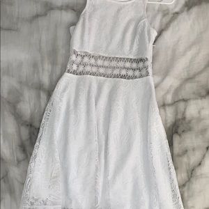 White mini dress, very flowy.